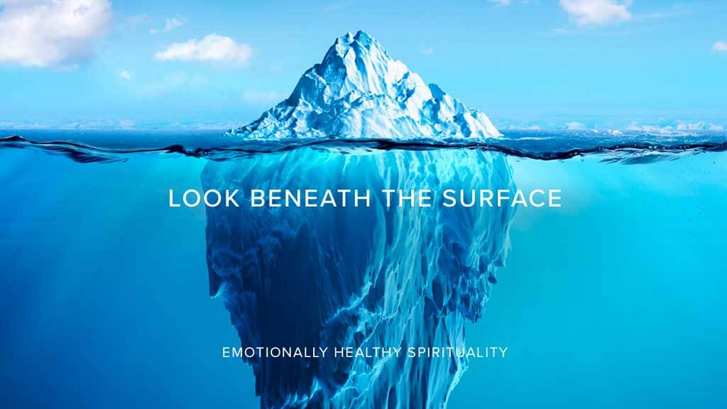 Iceberg illustration showing greater depth beneath the waterline, symbolising hidden strengths and unseen capability