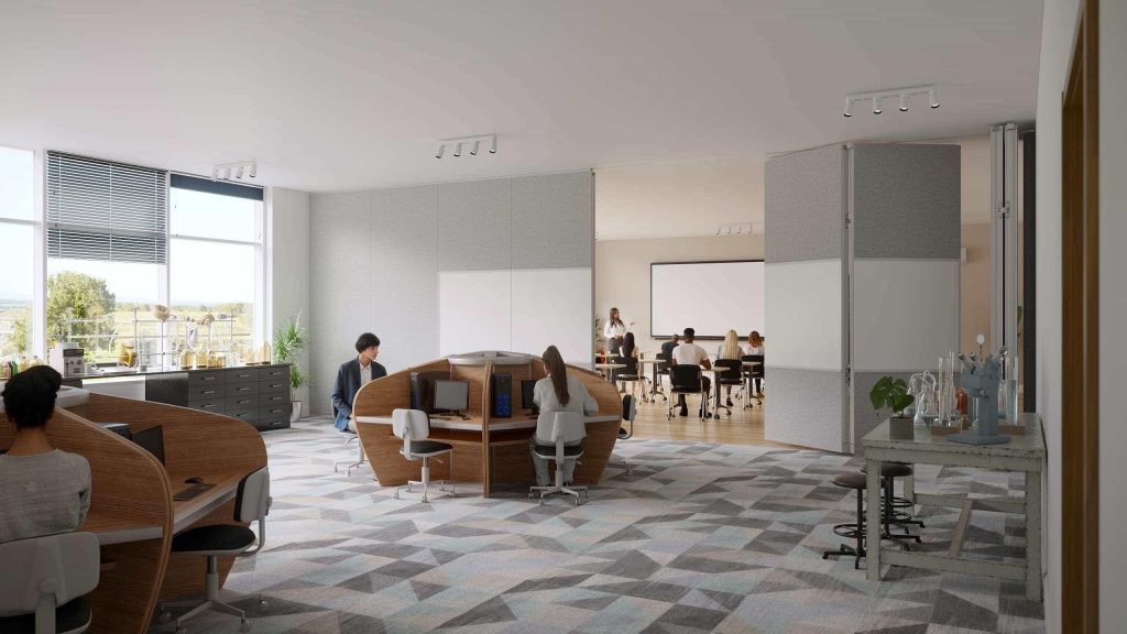 Modern learning environment combining individual workspaces and group instruction, supporting both focus and active engagement.