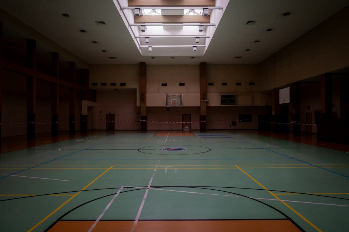 Indoor sports court with marked floor and clear open playing space