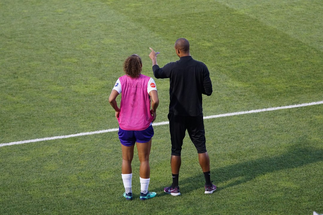 Young sports players listening to instructions before a game